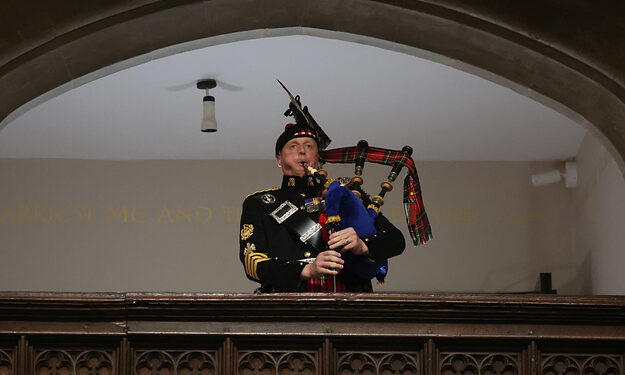 Queen’s Piper Plays Bagpipes At Funeral