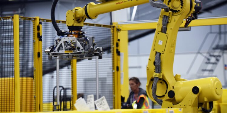 Top Amazon exec says it’s a ‘myth’ robots steal jobs